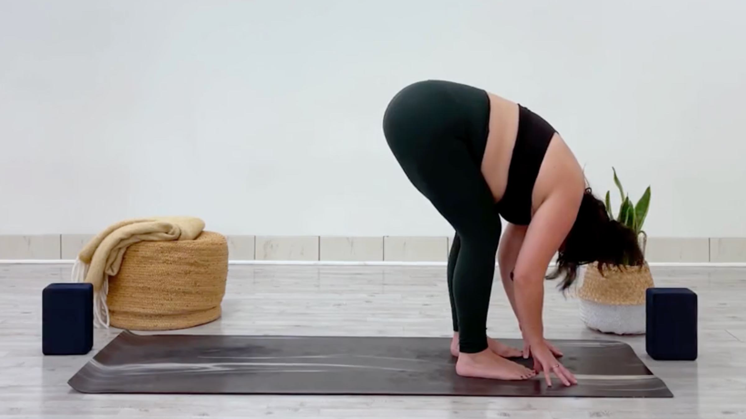 Yoga teacher Taylor Lorenz in Standing Forward Bend, Uttanasana in Sanskrit, part of her yoga for balance practice